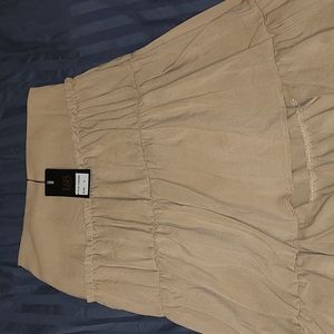 Lucky & Blessed. Tan, tiered, front cut long maxi skirt. New w tags.size small